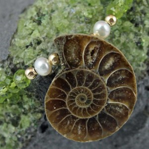 Fossil Ammonite with peridot, cultured pearls, and gold-filled. Item FAGFN103 Background of natural olivene crystals.